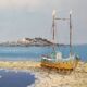 Oil on canvas of a boat on the foreshore signed Yann 55X45