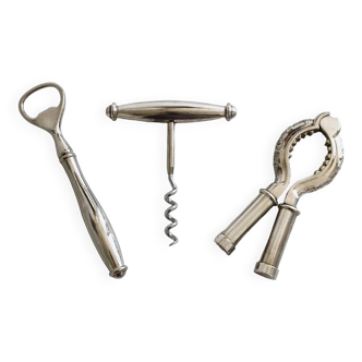 Bottle opener, nutcracker and metal corkscrew.