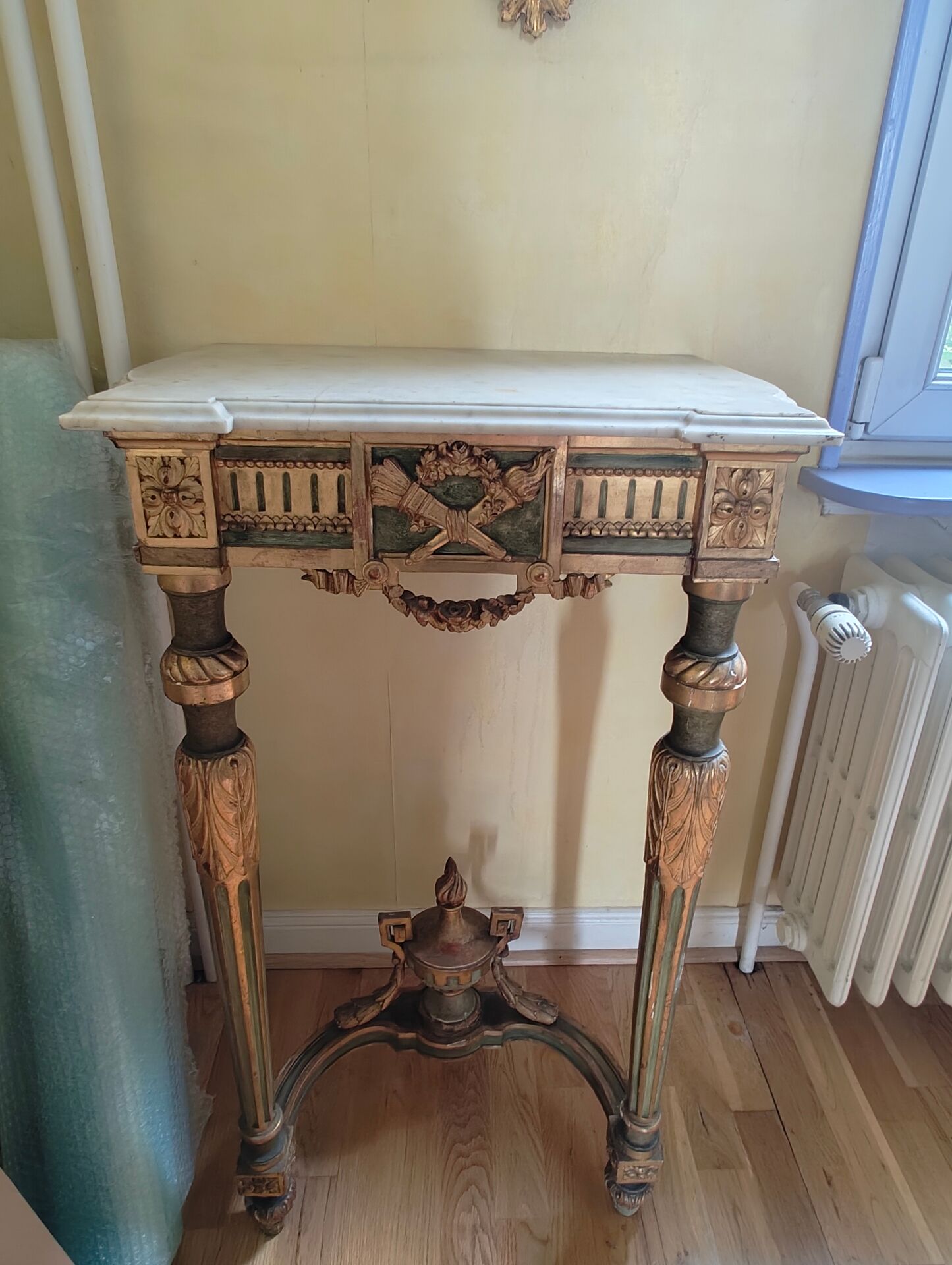 Golden wood and marble console in neoclassical style
