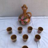 Old carafe with 8 ceramic glasses