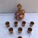Old carafe with 8 ceramic glasses