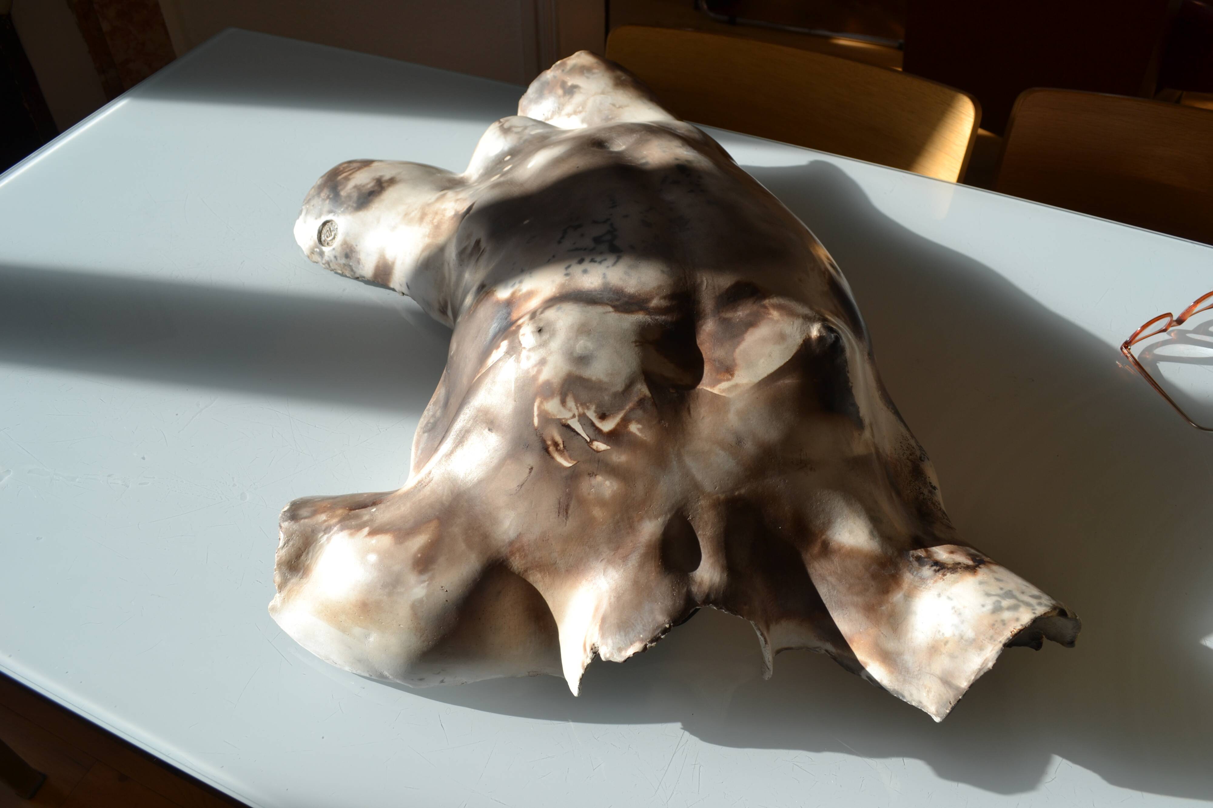 Male torso sculpture by patinated casting, signed to be identified.