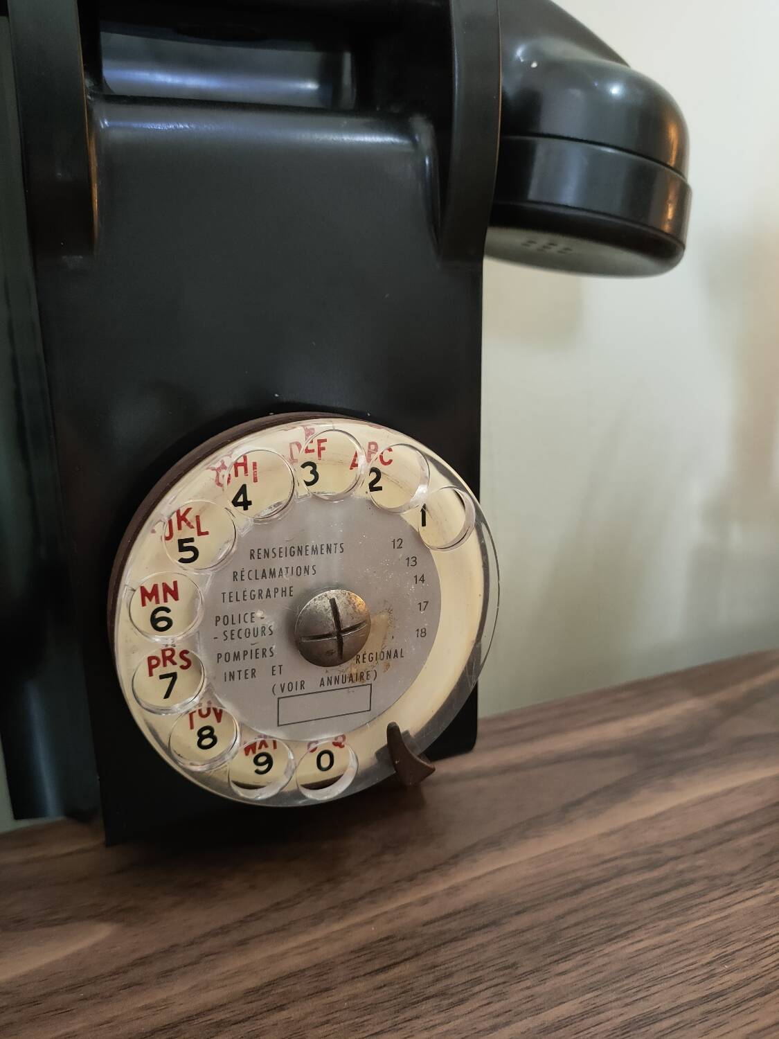 Old bakelite wall telephone