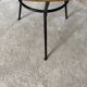 Tripod coffee table with a straw covering.