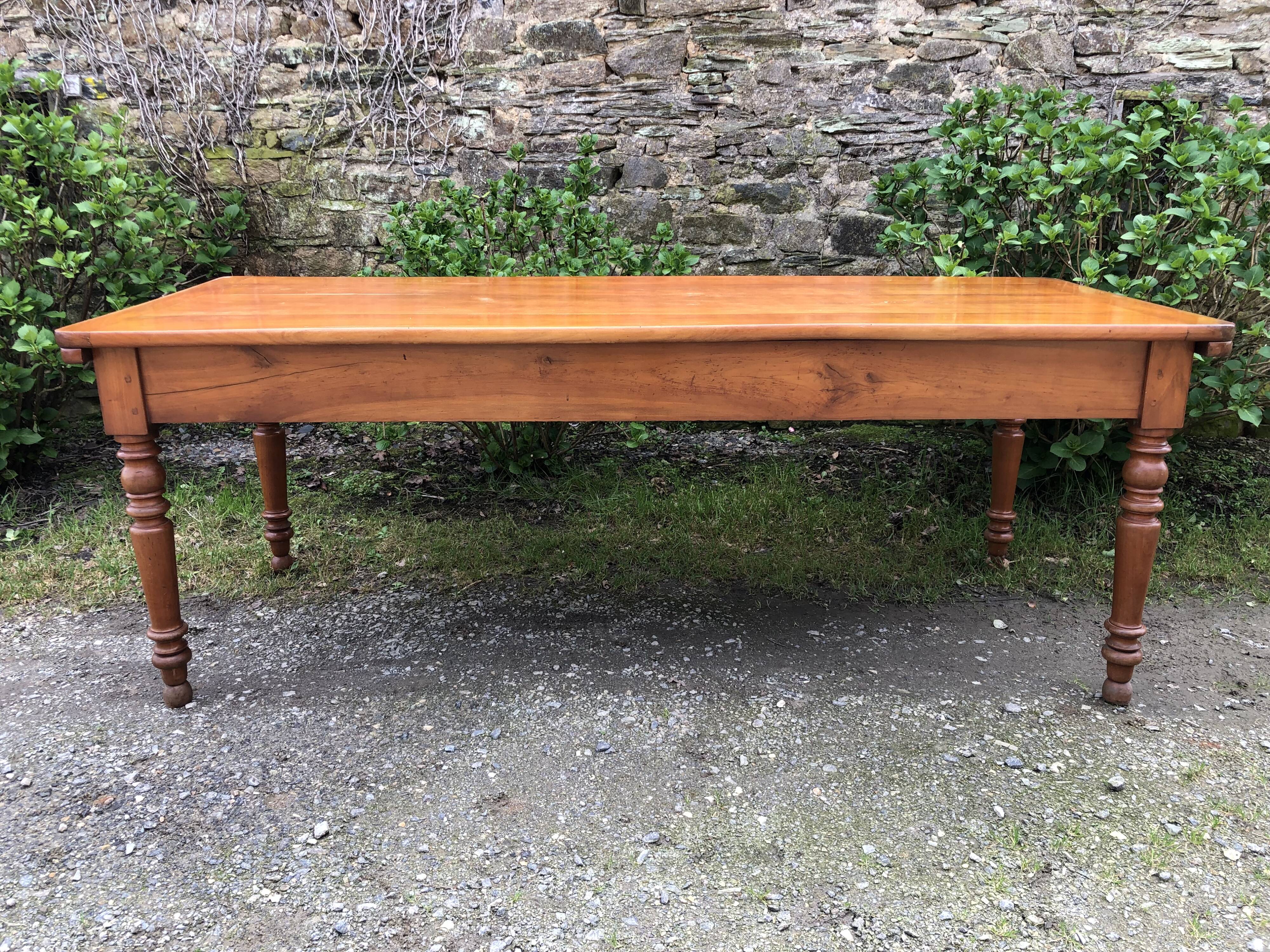 Antique Louis Philippe style farmhouse table in solid cherry wood with its 2 extensions.