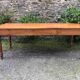 Antique Louis Philippe style farmhouse table in solid cherry wood with its 2 extensions.