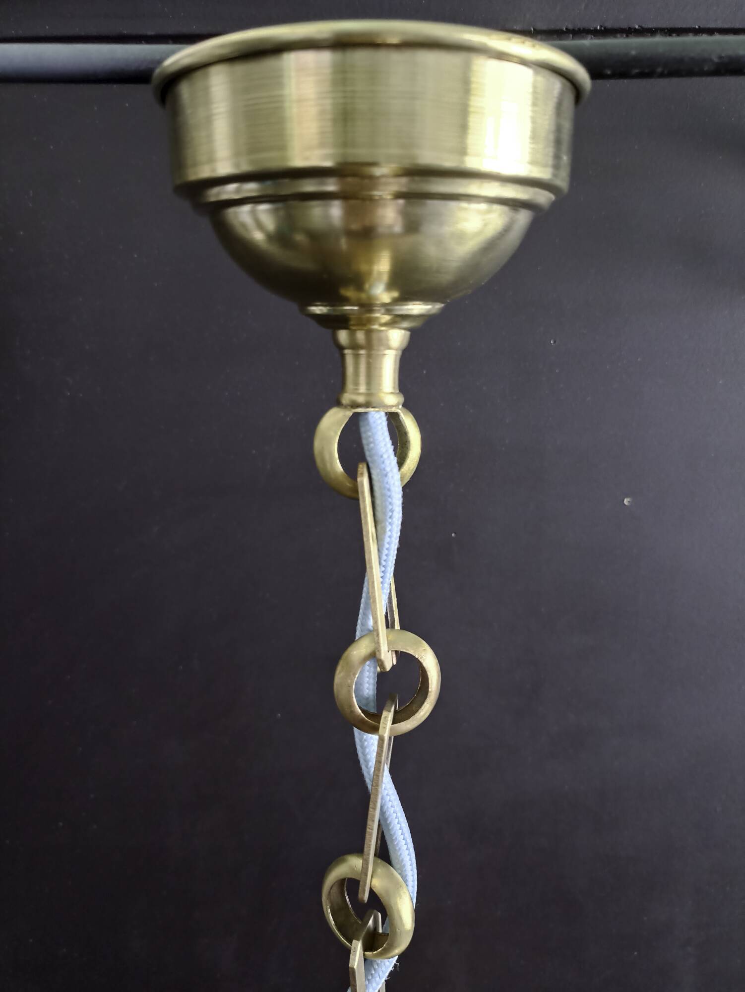 Brass pendant light with oversized LED bulb