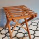 Old foldable stool in tinted wood