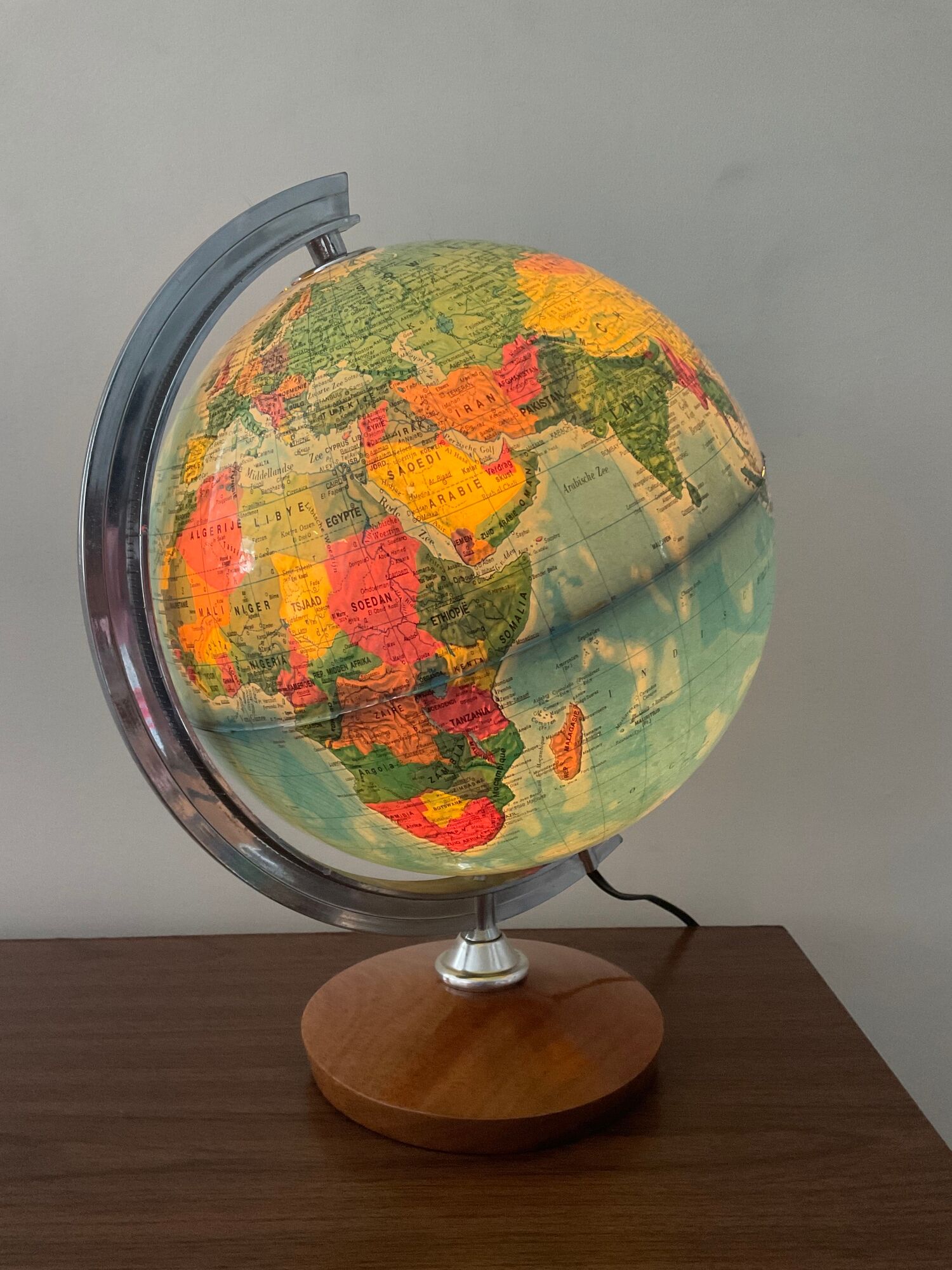 Bright vintage world map with wooden foot