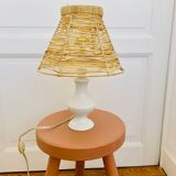 White porcelain table lamp and vintage raffia lampshade