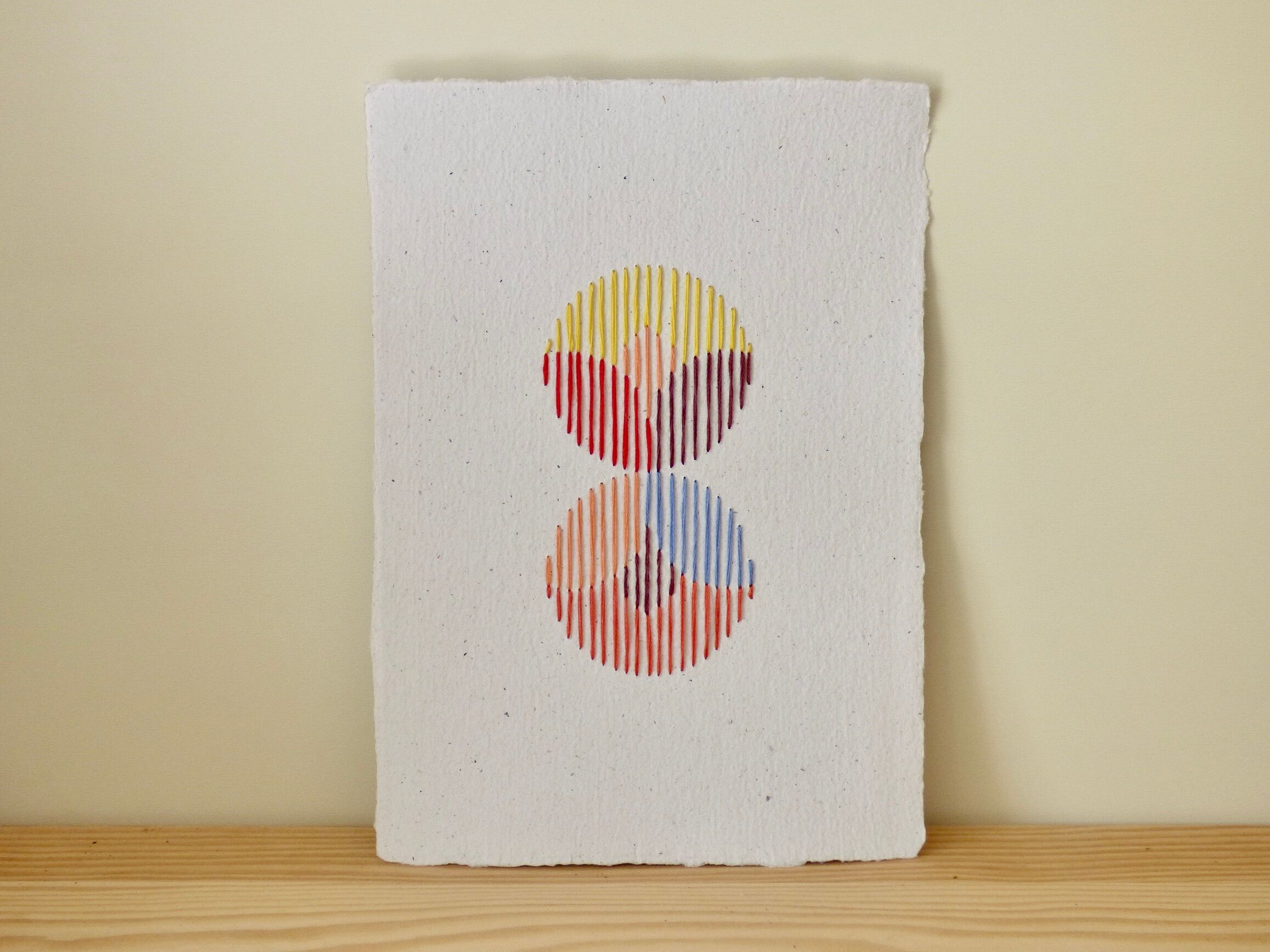 hand-embroidered card on recycled paper