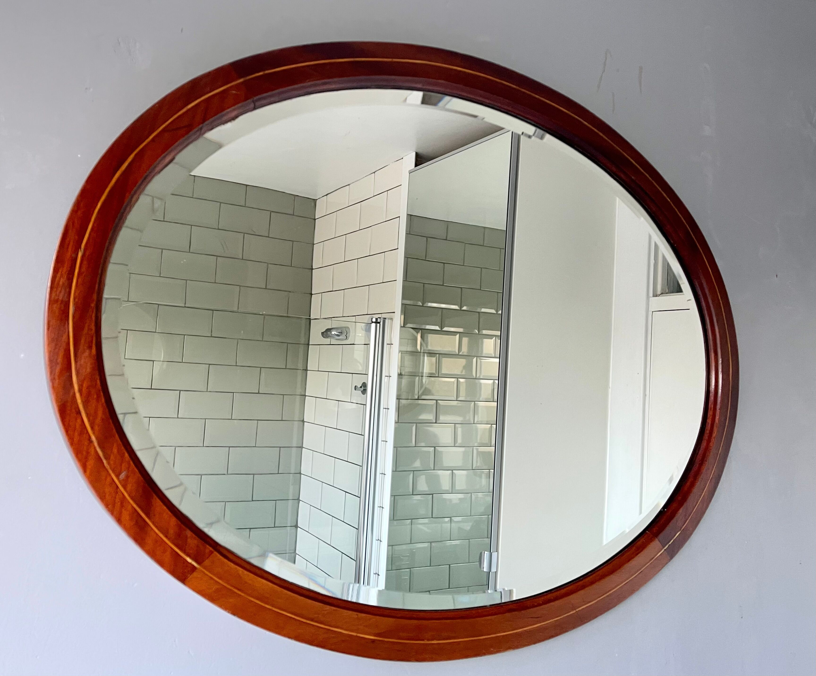 Vintage oval bevelled mirror mahogany frame