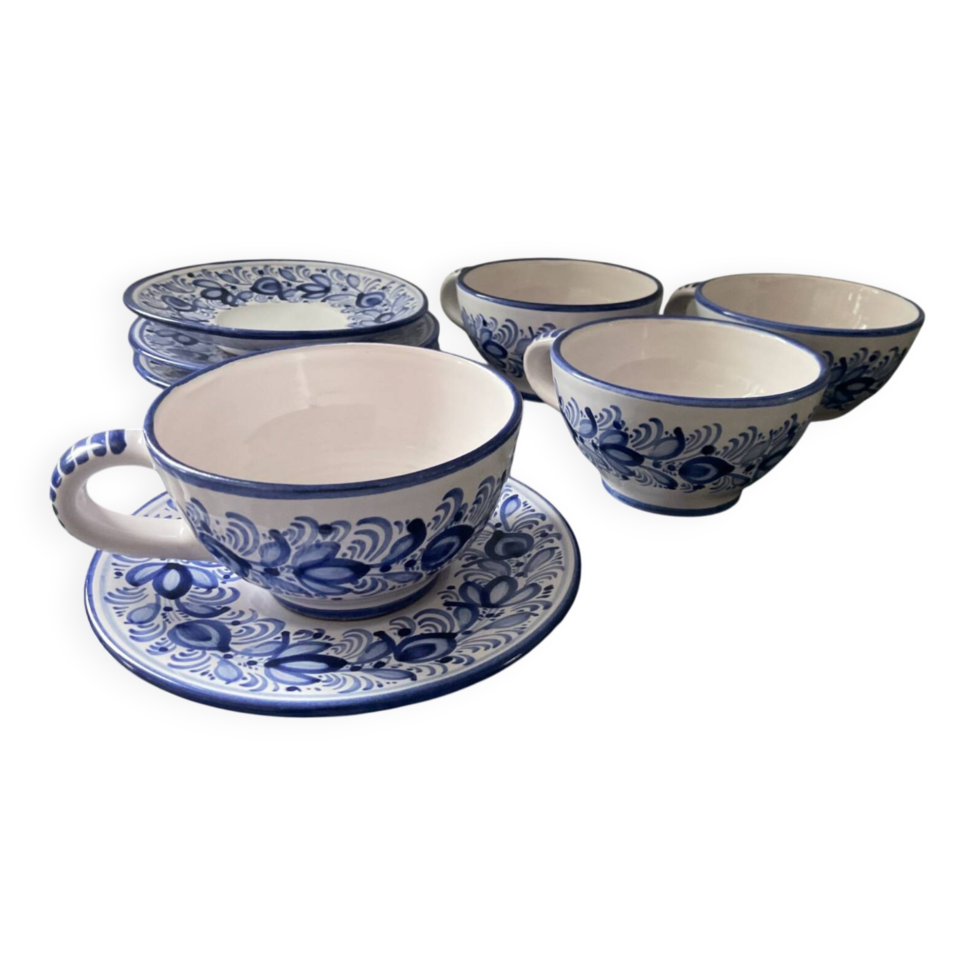 Set of 4 white/blue ceramic cups and saucers.