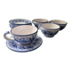 Set of 4 white/blue ceramic cups and saucers.