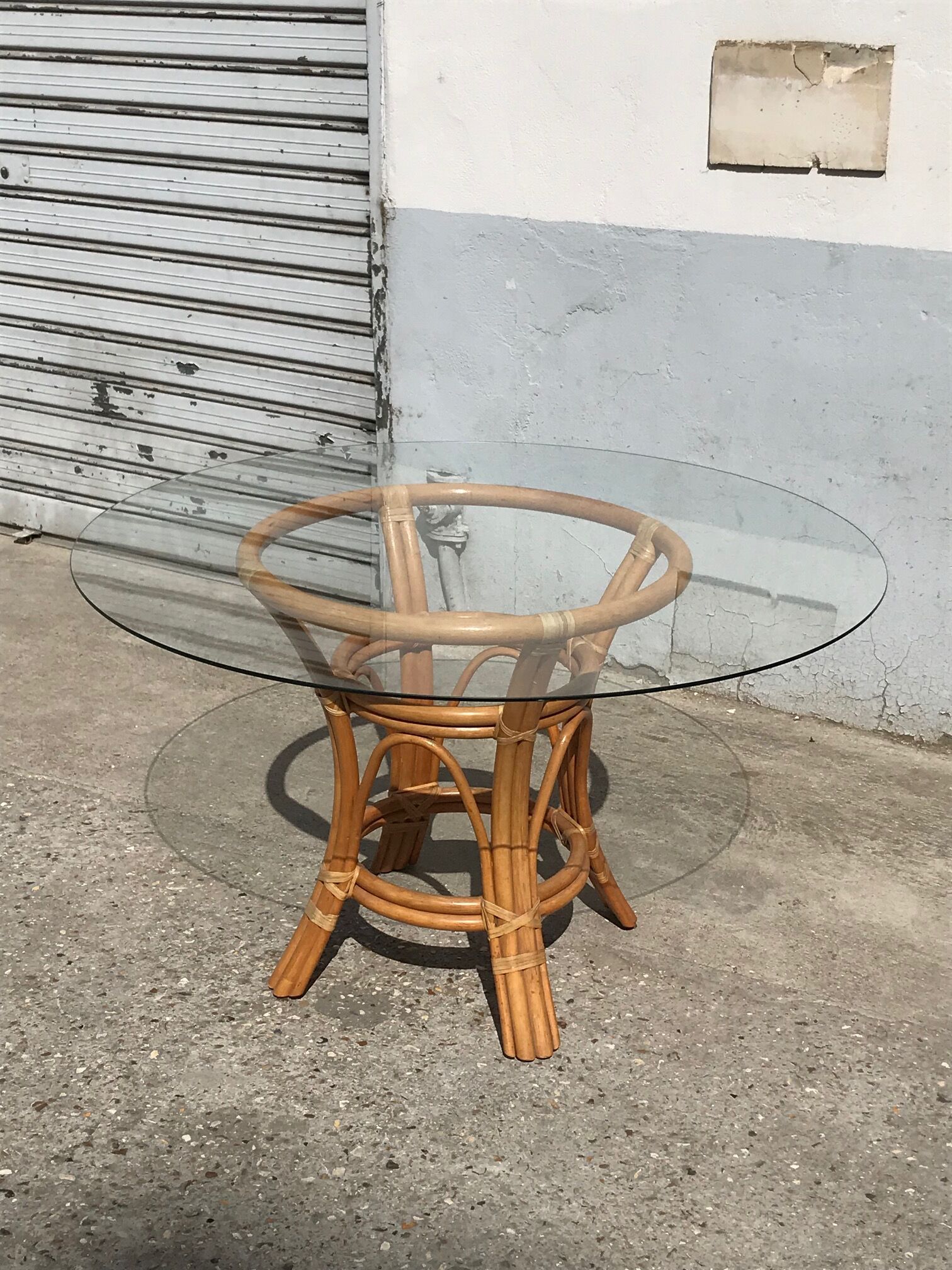 Rattan and glass dining table