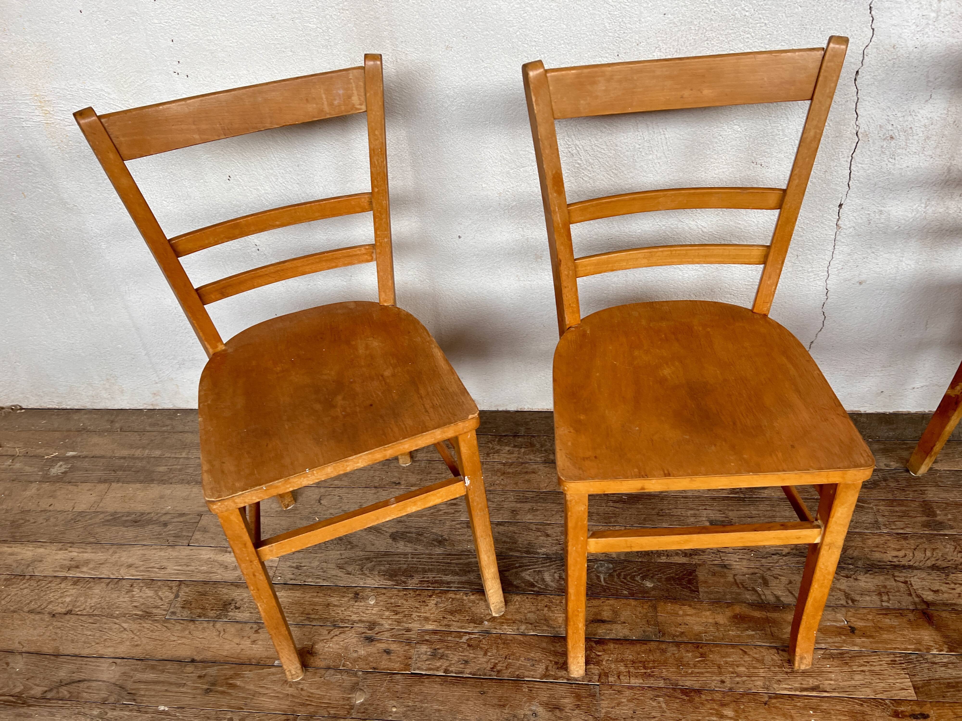 Series of 4 vintage light wood bistro chairs