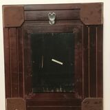 Oil on panel in the center of a frame