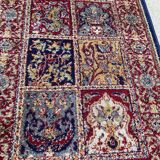 Vintage mechanical Turkish rug with box decoration on a red and navy blue background 139 x 68 cm