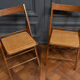 Suite de 11 chaises pliantes avec cannage 1980 entourage bois