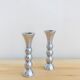 Pair of vintage cast aluminum candle holders