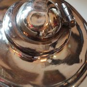 Ancient samovar tea fountain in silver metal