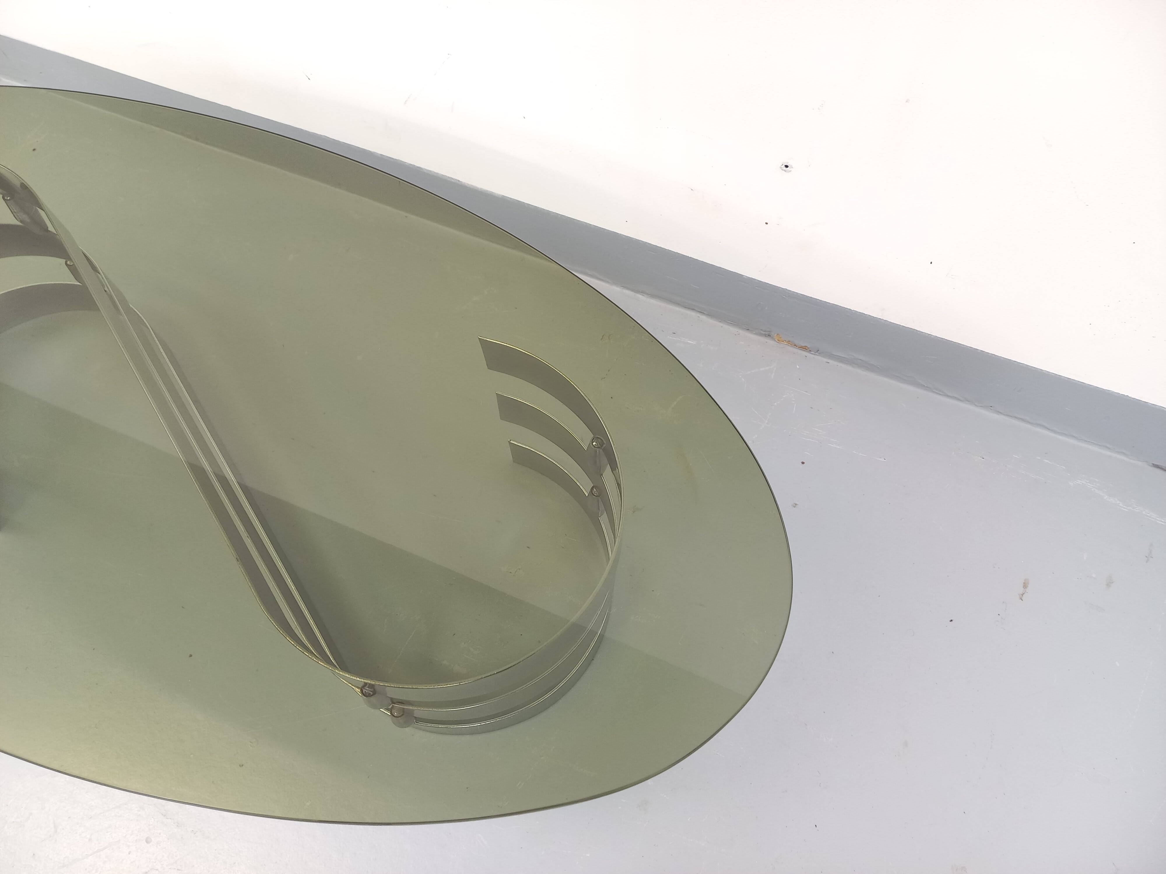 Vintage oval coffee table in smoked glass and chrome metal from the 1970s.