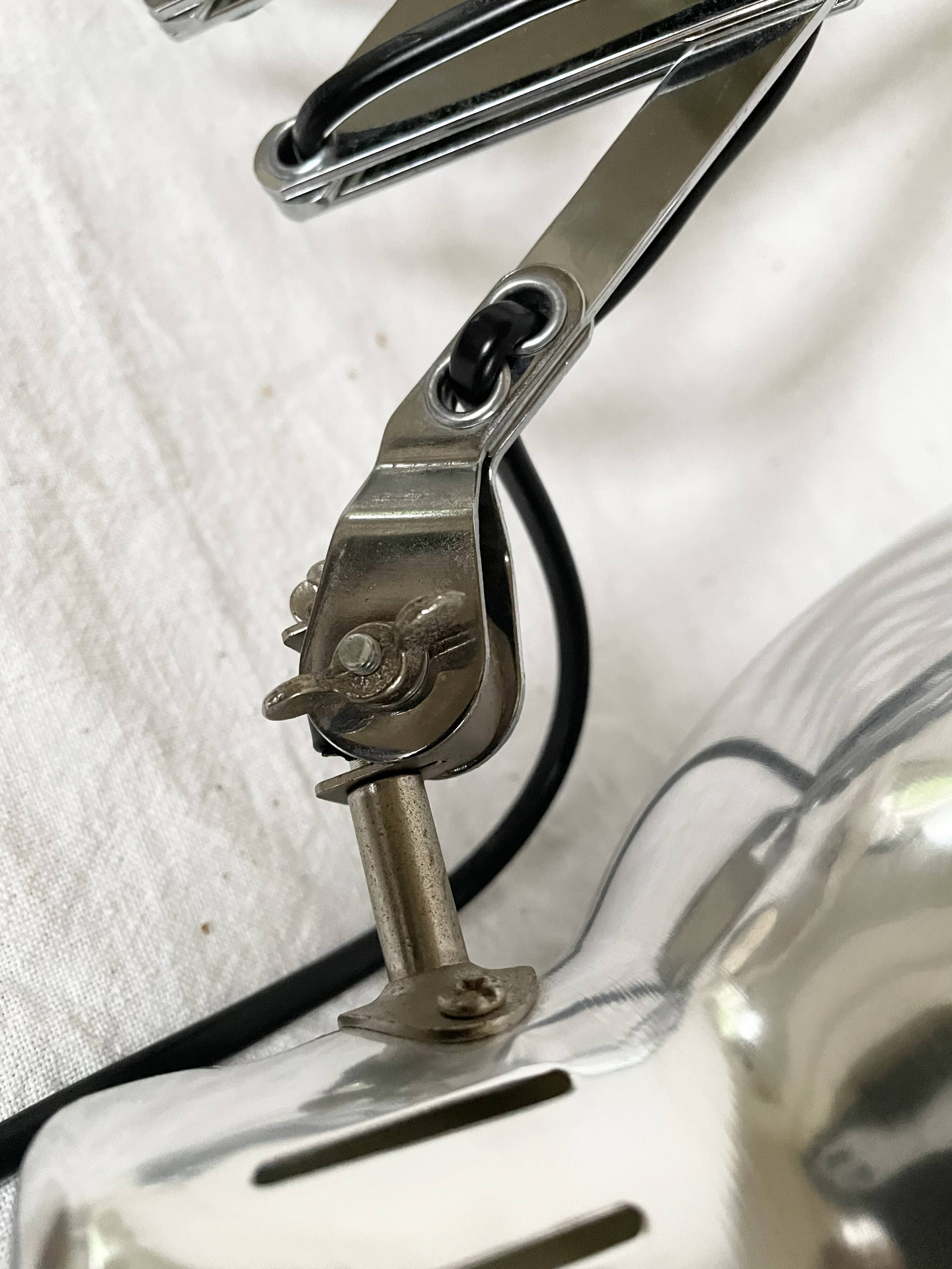 Vintage accordion wall light in chrome metal.