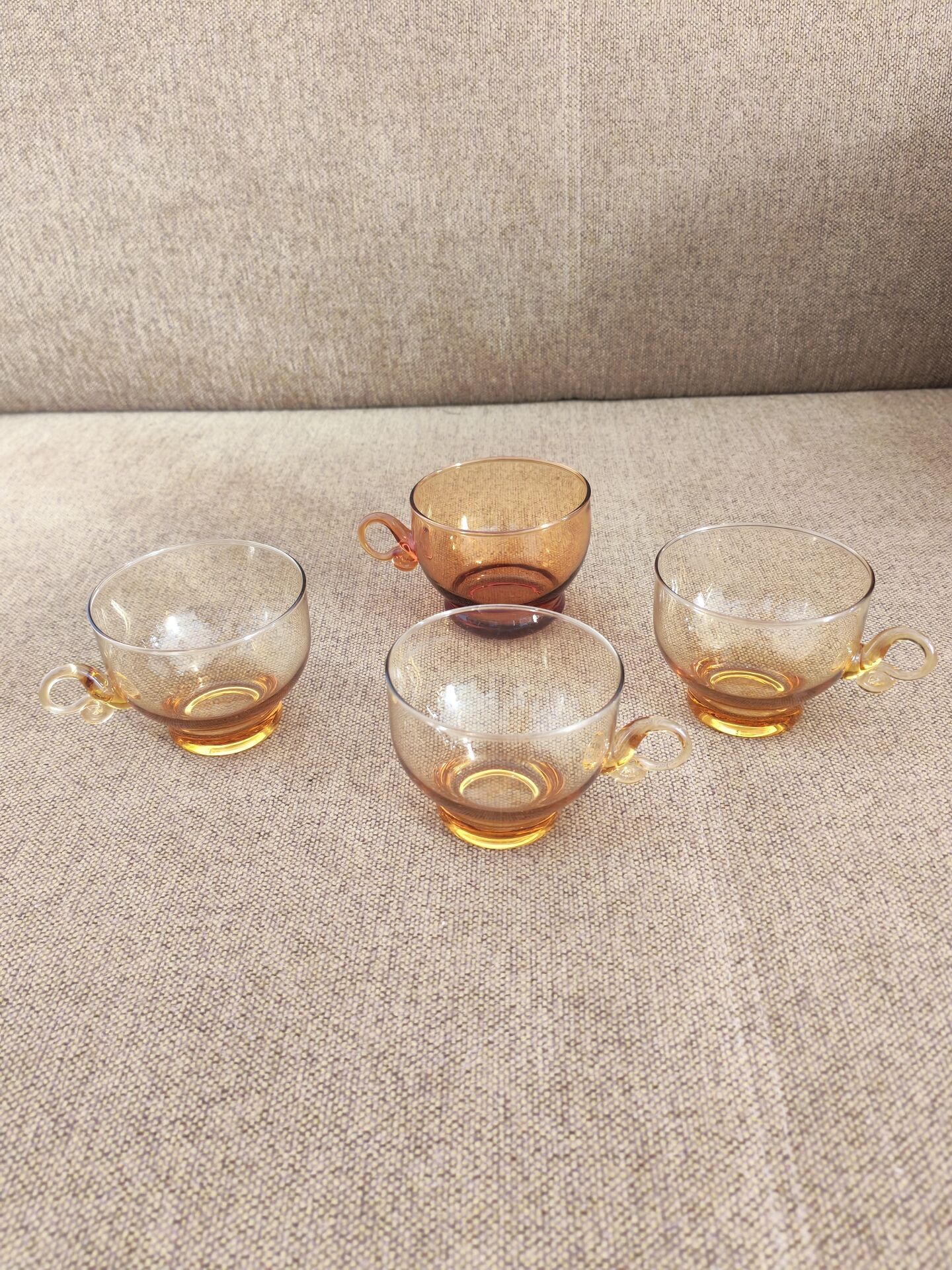 Set of four vintage amber glass cups