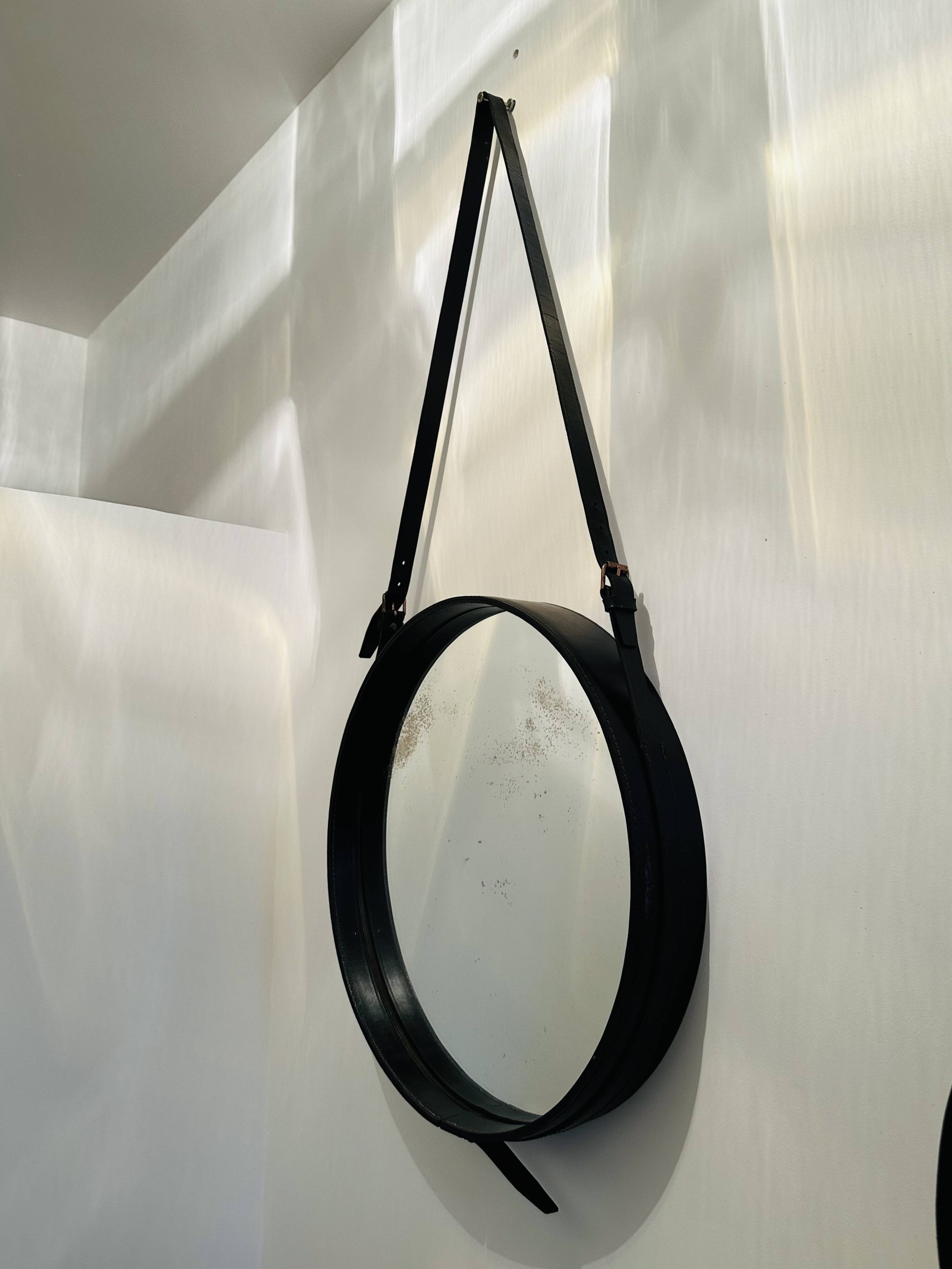 Jacques Adnet circular leather and brass mirror