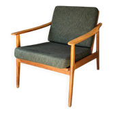 Scandinavian style armchair in light wood and dark green fabric, circa 1960.