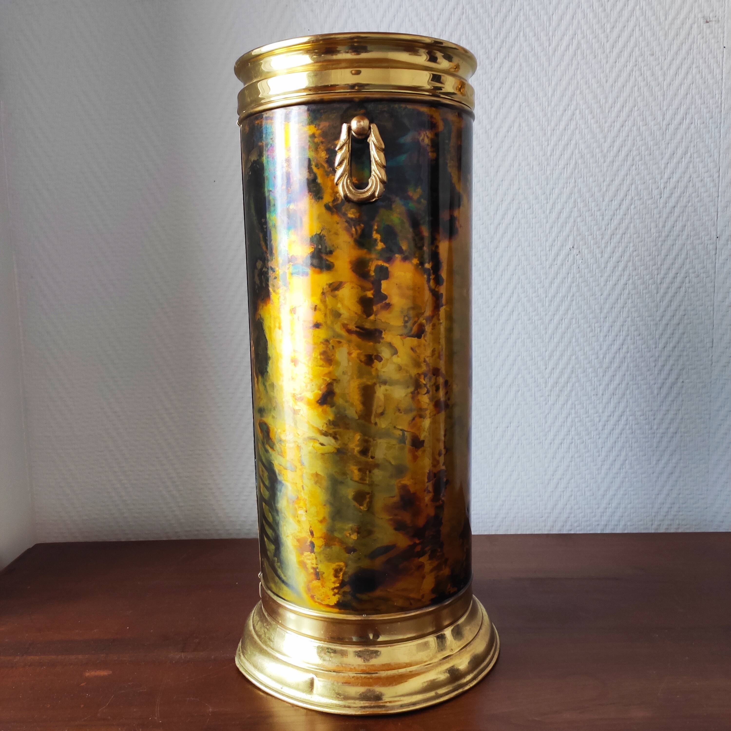 Flame-patterned golden umbrella stand
