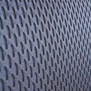 Vitra ID Trim office chair by Antonio Citterio — black mesh backrest and blue fabric seat, aluminium frame.