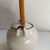 Flowered stoneware teapot with vintage rattan handle
