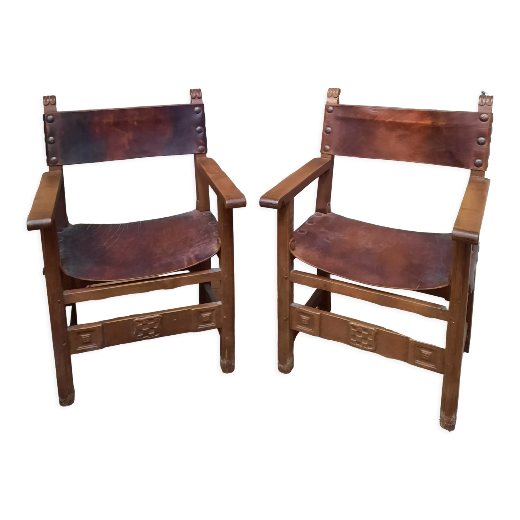 Pair of medieval leather style armchairs