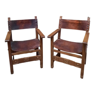 Pair of medieval leather style armchairs