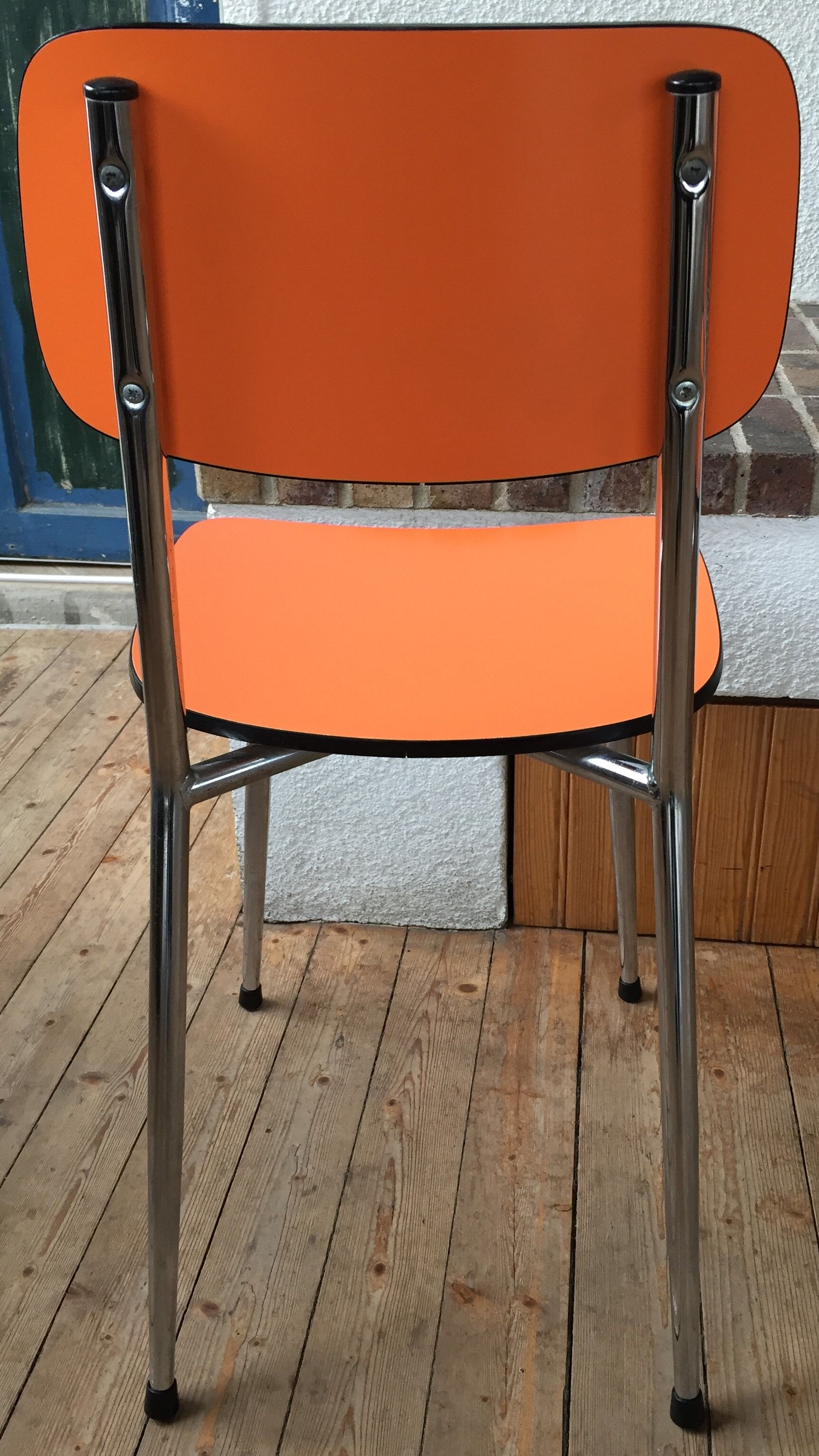 Lot of 4 vintage chairs in orange formica