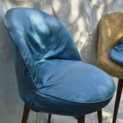 2 Scandinavian chairs with compass legs in faux fur and blue satin covers, 1970.