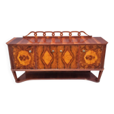 Very Art Deco in burl walnut veneer.