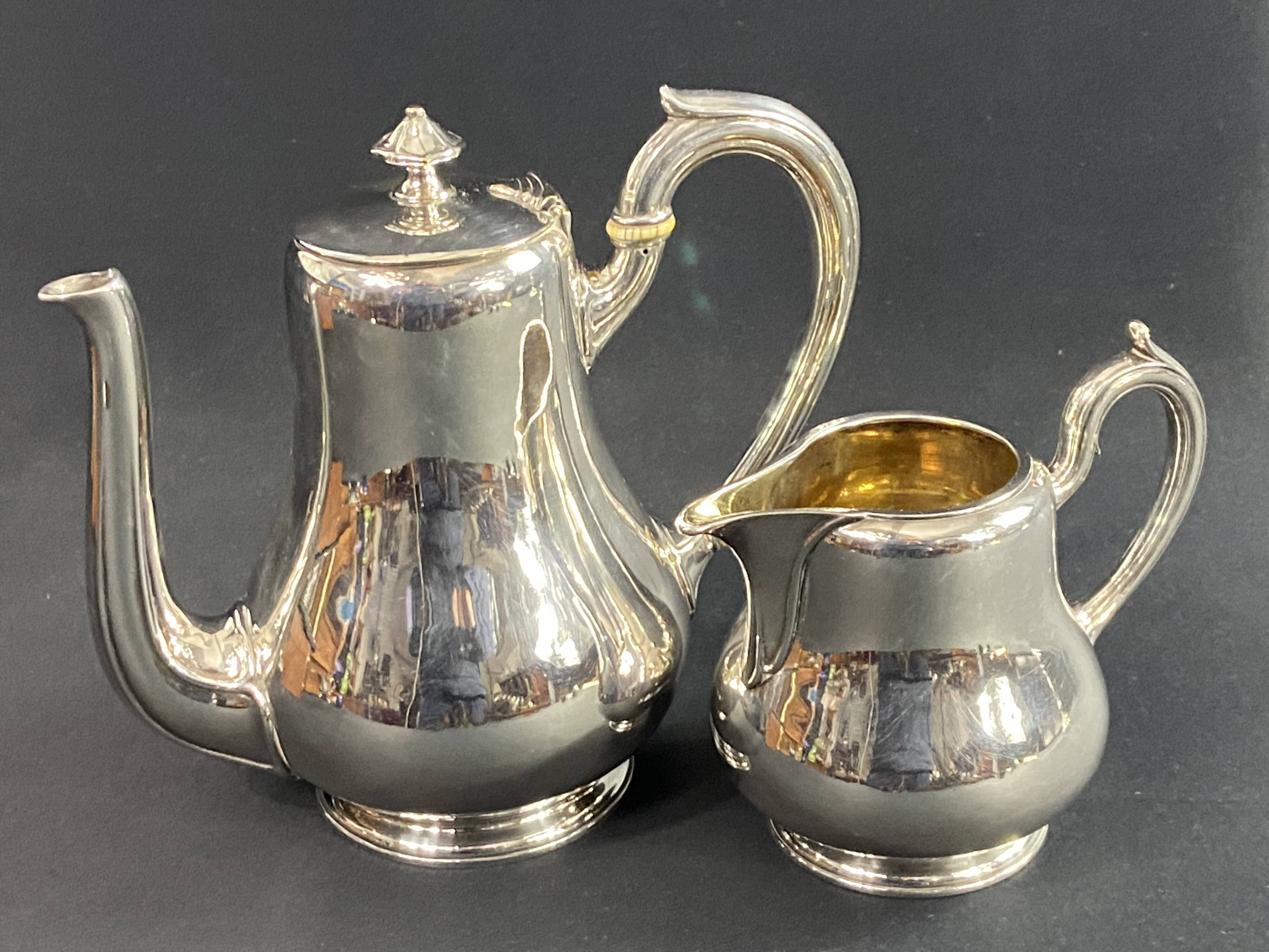 Silver-plated coffee pot and milk jug monogrammed MA, signed CHRISTOFLE.