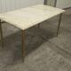 Marble coffee table with brass legs, height 46 cm.