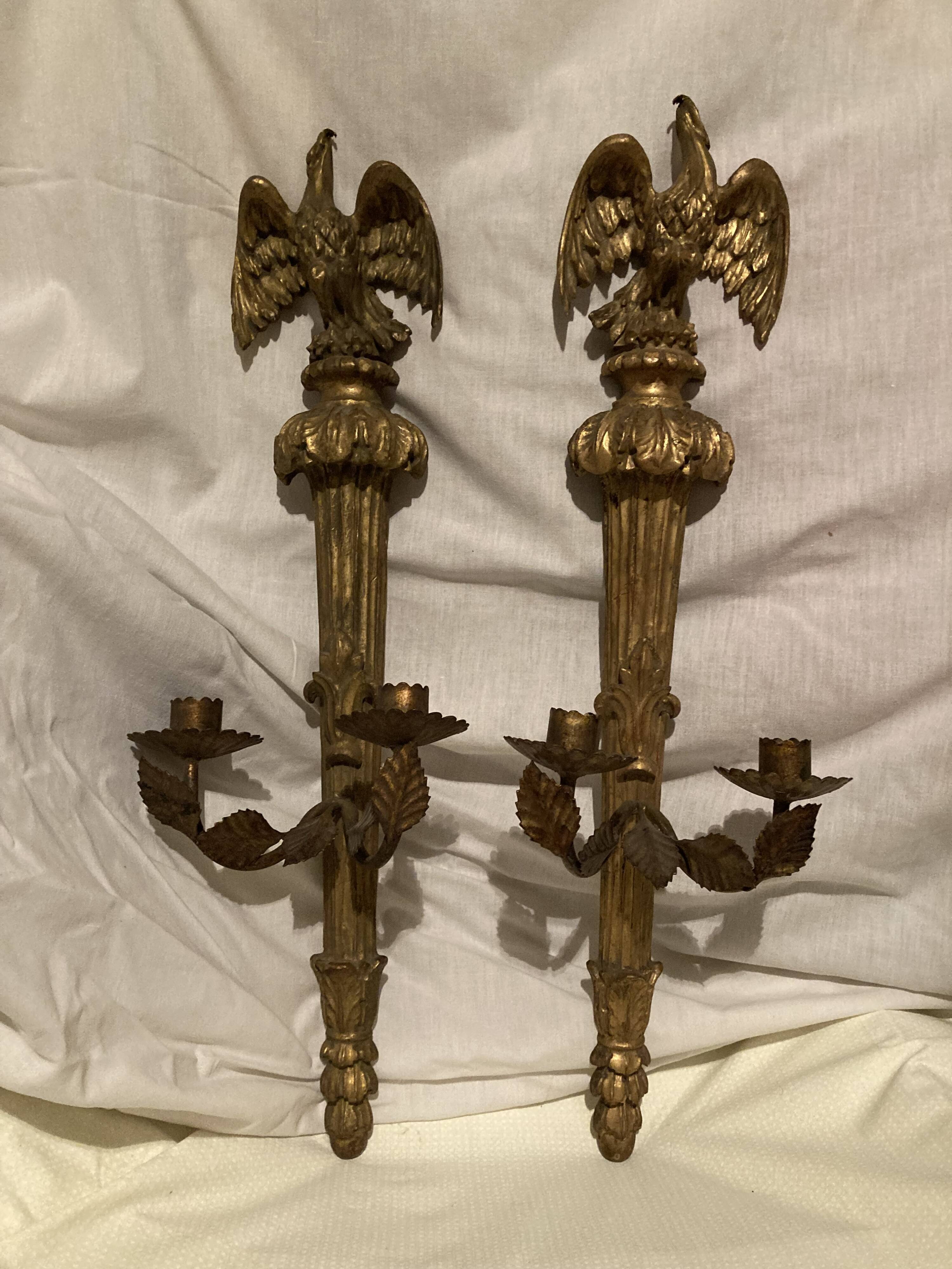Pair of candle holders in wall, eagle pattern in gilded wood and brass