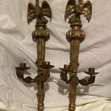 Pair of candle holders in wall, eagle pattern in gilded wood and brass