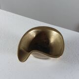 Vintage brass ashtray with an organic design from the 1950s.