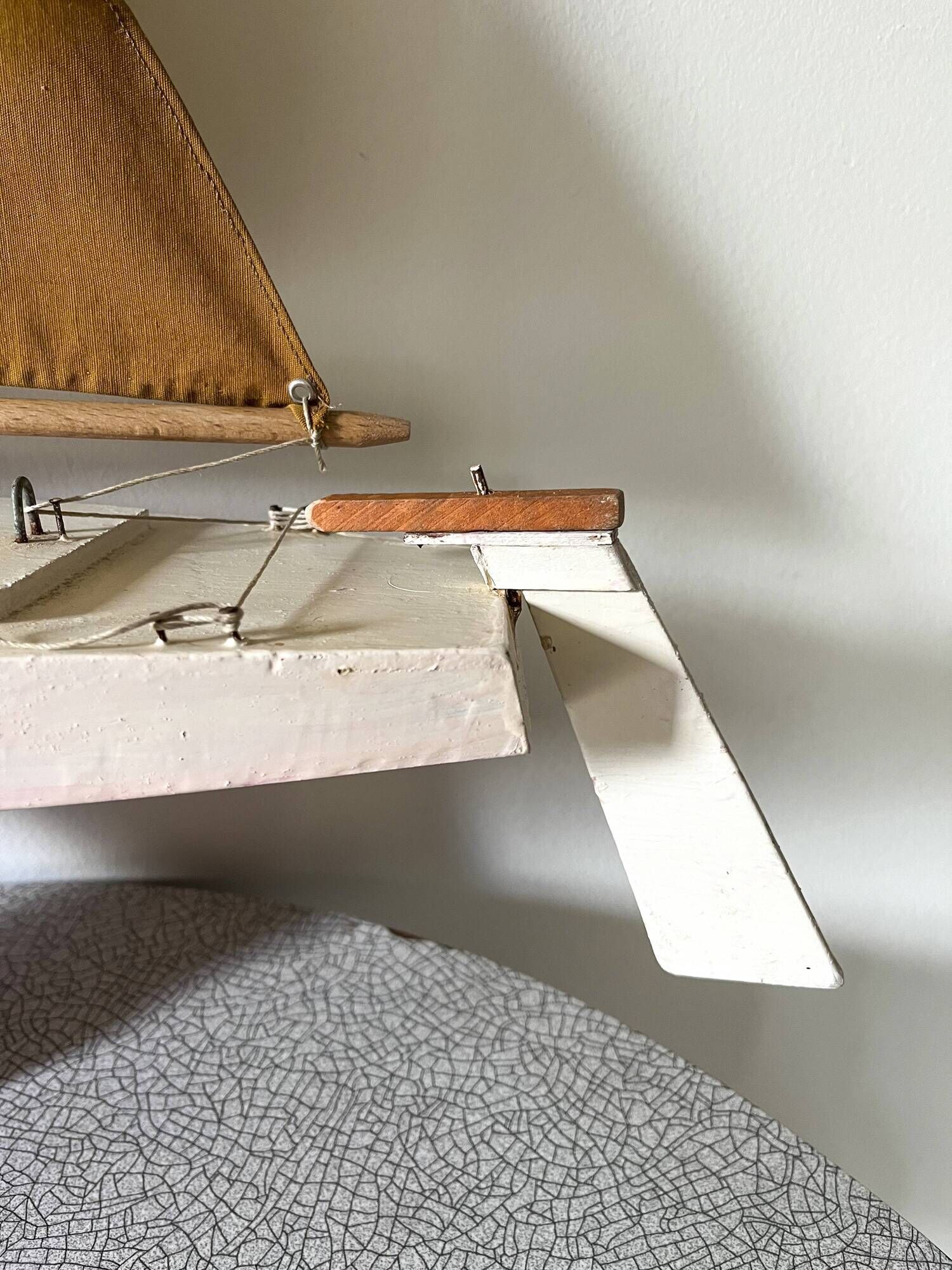 Navigable wooden sailing ship with pretty vintage colors