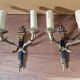 Pair of Empire-style wall sconces in gilded bronze and green lacquer.
