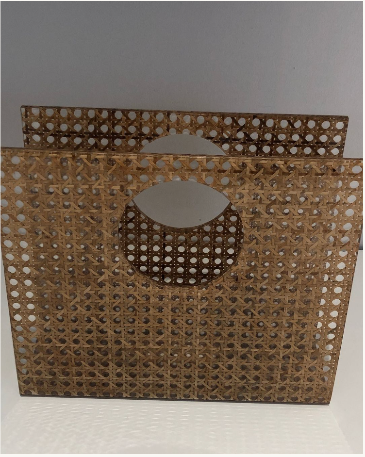 Acrylic magazine rack with inlaid cane.