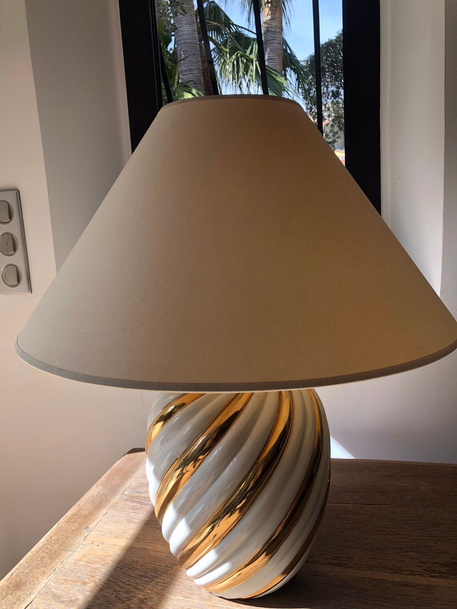 Pair of lamps of the brand Koska in white and twisted gold, with lampshade
