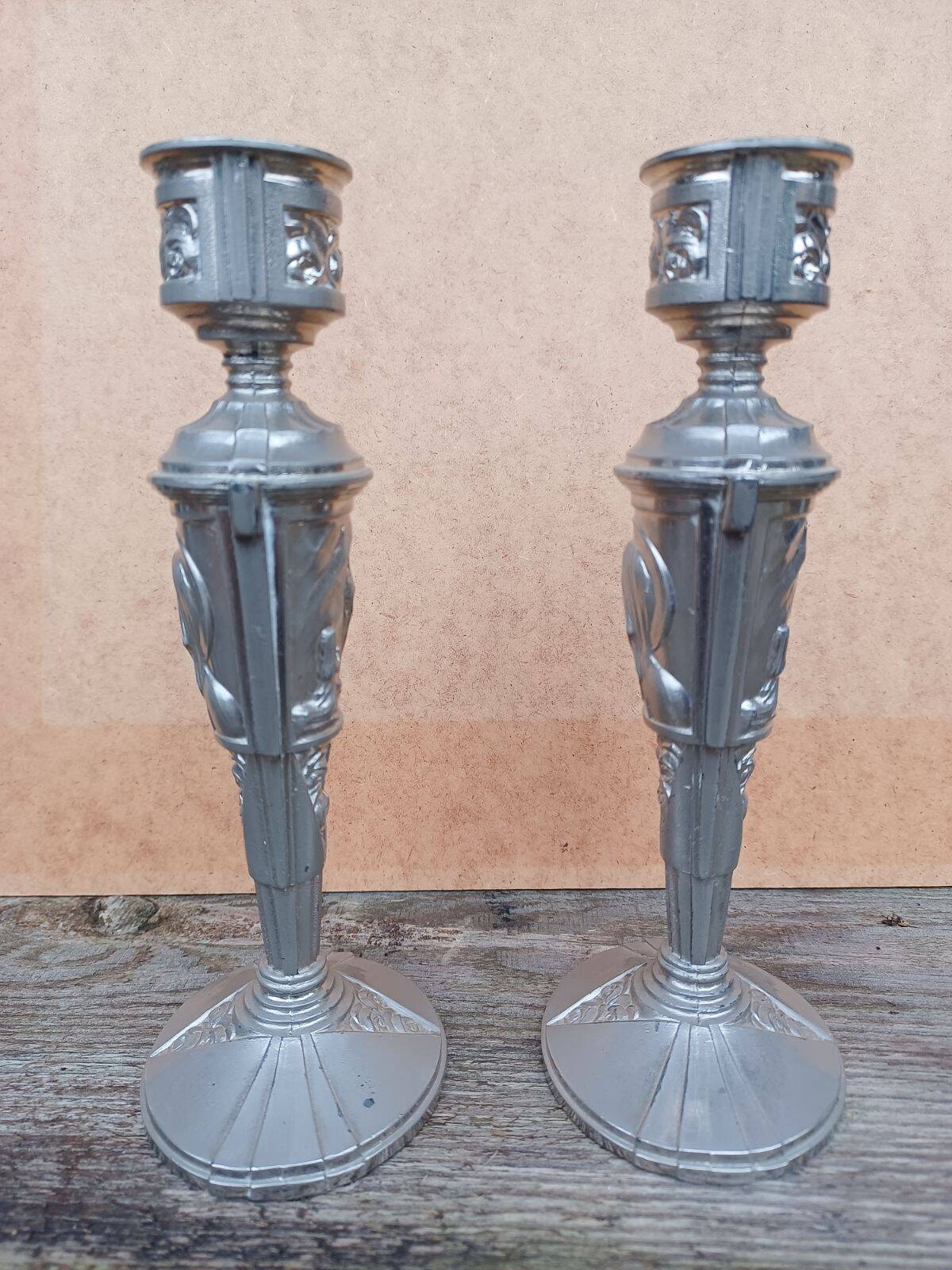 Pair of candlesticks with religious and Art Deco decor