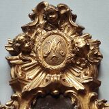 Petit miroir suspendu en métal doré