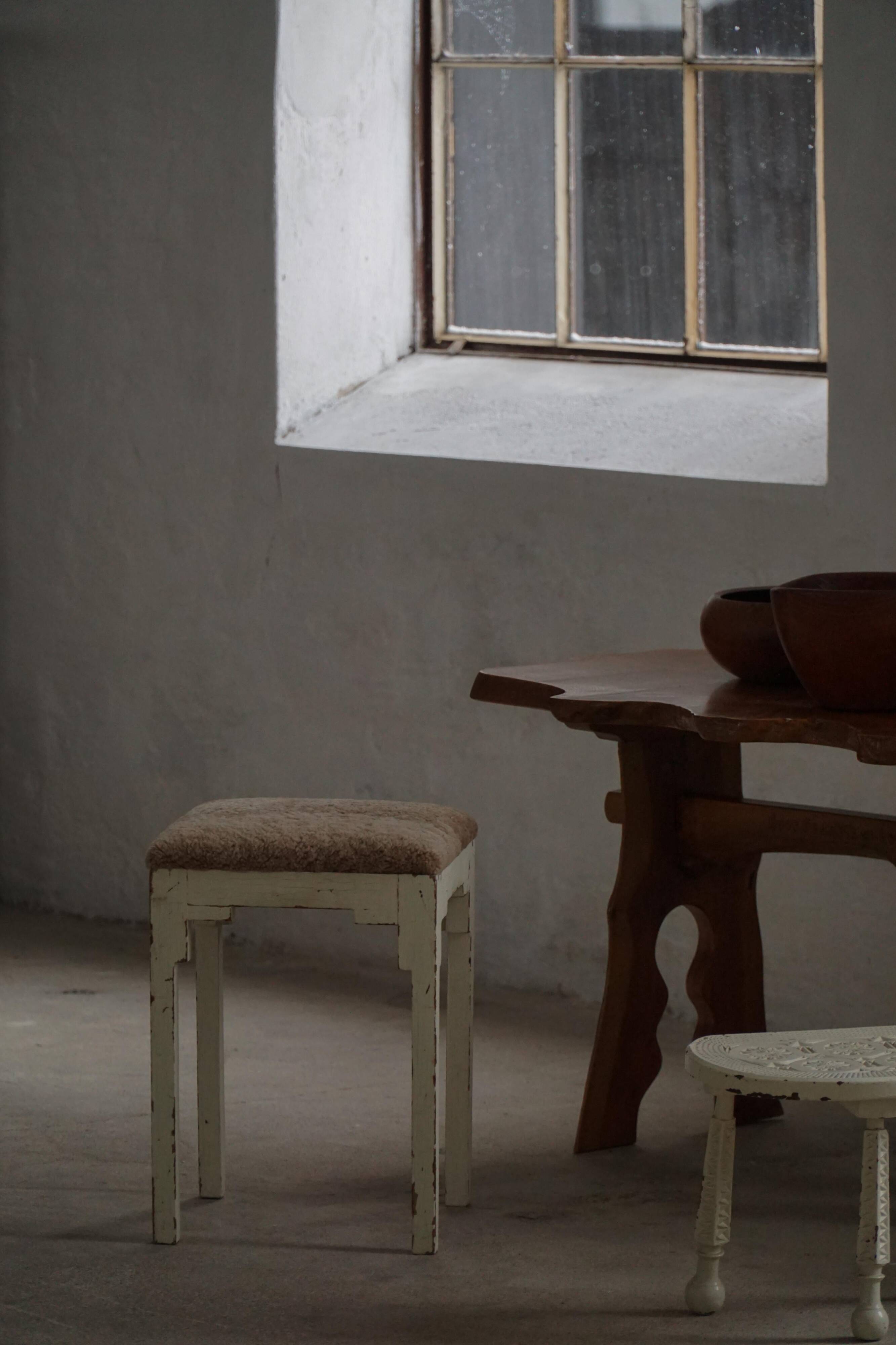 A pair of antique Danish stools, seats in lambswool, late 19th century.